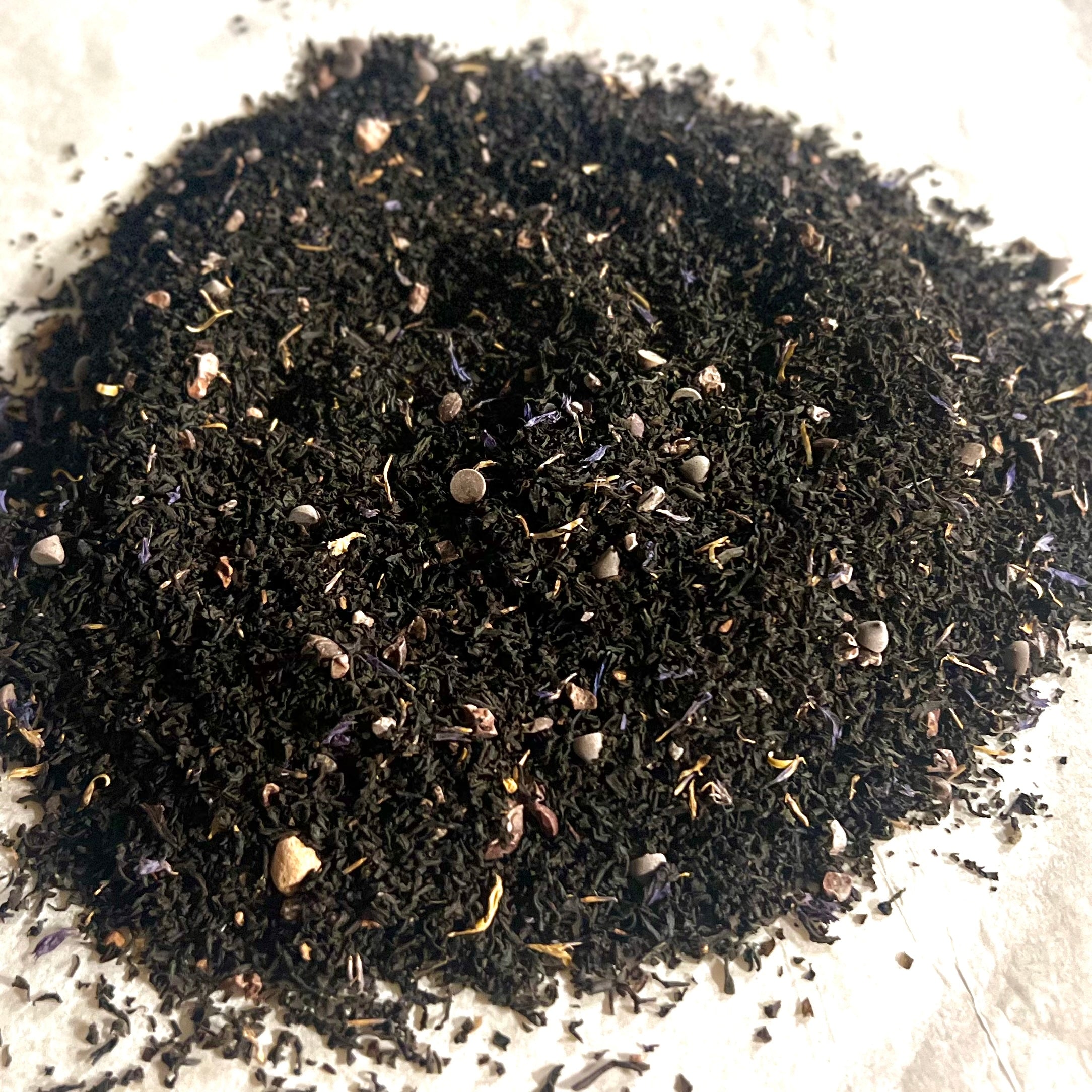 Loose dark Ceylon black tea blended with cocoa nibs and chocolate pieces for Chocolate Lover's Delight tea blend
