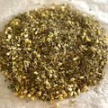 Close-up of Drift Away loose herbal tea blend with valerian root, passionflower, and linden on a light surface for relaxation.