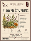 A square tea packet label for R&R Rhythms & Rituals Tea Collection's 'Flower Covering' blend. The label features a vintage botanical illustration of various herbal plants, roots, and flowers on a warm cream background with dark brown text and borders.