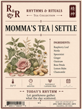 A vintage-style tea label for R&R Rhythms & Rituals 'Momma's Tea | Settle' from Jing Shen Healing Arts. The cream-colored label features an illustration of a pink rose, green leaves, and ginger roots, with a listed ingredients section and product details.