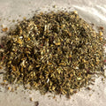 Close-up of loose Soothe Throat herbal tea blend with dried herbs and spices for natural throat relief and calming comfort