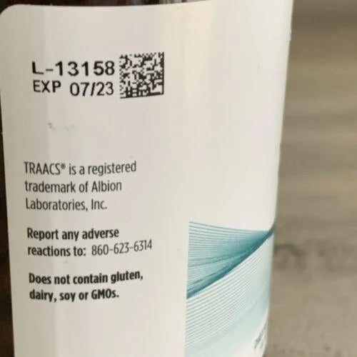 Back label of a product with a QR code, expiration date, and contact information.